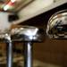 A bar stool reflection of patrons eating at Wolverine Grill in Ypsilanti on Tuesday. Daniel Brenner I AnnArbor.com